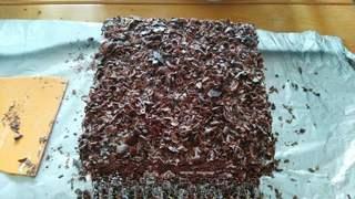 Black Forest Cake step 23: Decorate the cake with chocolate shavings.