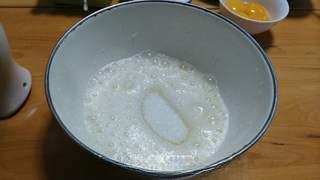 Black Forest Cake step 3: Beat the egg whites on low speed until foamy, then add one-third of the sugar.