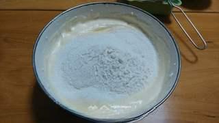 Black Forest Cake step 7: Sift the cake flour over the batter.