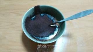 Black Forest Cake step 9: Melt the milk and butter together, then whisk in the cocoa powder.
