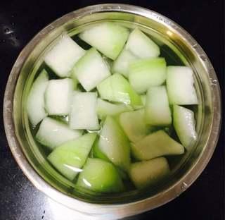 Braised Pork Ribs with Winter Melon step 9: Cut the winter melon into large chunks or thick slices, blanch briefly in boilin