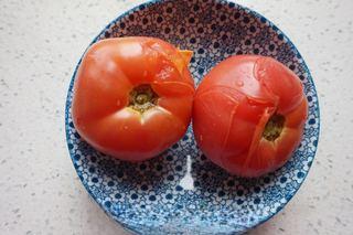 Tomato and Dough Drop Soup step 3: Score the tomatoes and blanch briefly in boiling water. Remove the skins and cut