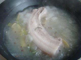 Steamed Pork Belly with Preserved Mustard Greens step 4: Bring to a boil and simmer for about 20 minutes until partially cooked.