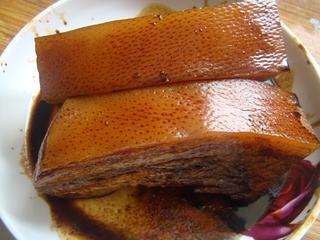 Steamed Pork Belly with Preserved Mustard Greens step 5: Remove the pork while still warm, cut into large sections, and brush the skin wi