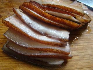 Steamed Pork Belly with Preserved Mustard Greens step 7: Slice the pork belly into evenly sized pieces.
