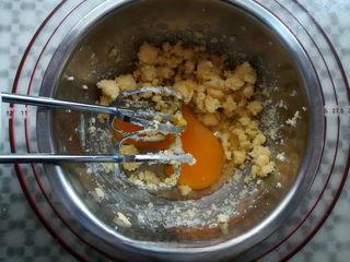 Coconut Custard Balls step 4: Add the beaten egg in two additions, mixing well after each addition.