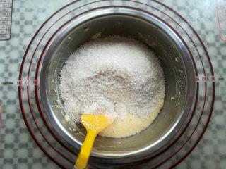 Coconut Custard Balls step 7: Fold in the cake flour and coconut flakes until a soft dough forms with no dry i