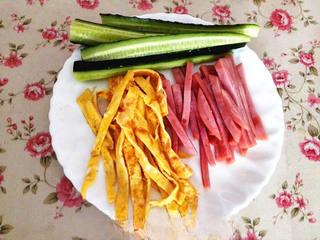 Ham and Cucumber Sushi Rolls step 4: Cut the cucumber and ham into thin strips. Slice the omelet into narrow ribbons.