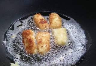 Crispy Fried Milk Recipe step 10: Continue frying until golden brown on all sides, then drain on paper towels.