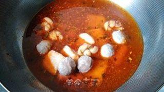 Spicy Hot Pot Noodle Soup step 7: Add the fish balls, fish tofu, Chinese sausage, and bean curd knots. Simmer unti