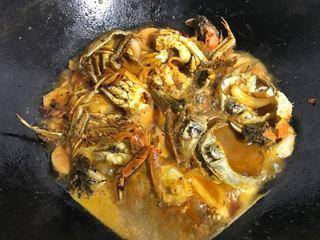 Spicy Stir-Fried Crab step 15: Return the peppers to the wok and continue cooking until the crab is fully coate