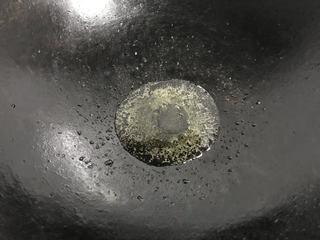 Spicy Stir-Fried Crab step 8: Heat oil in a wok over medium-high heat.