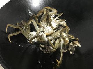 Spicy Stir-Fried Crab step 9: Fry the crab pieces until lightly golden and set aside.