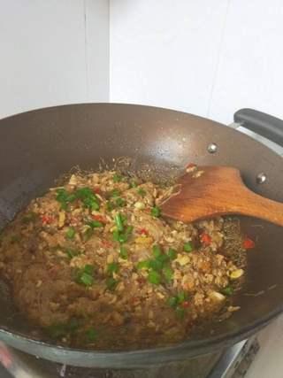 Spicy Glass Noodles with Minced Pork step 8: Pour in about 1/2 cup water and bring to a boil. Reduce to medium heat and cook