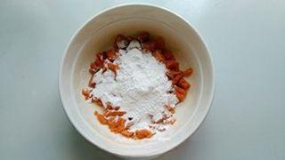 Pumpkin Red Bean Cakes step 3: Mash the cooked pumpkin while warm. Once slightly cooled, gradually mix in the g