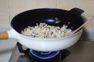 Omelette Fried Rice step 10: Stir-fry until the rice is evenly heated and separated.