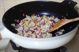 Omelette Fried Rice step 12: Season with black pepper and cilantro, then stir well. Transfer the fried rice t