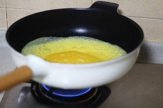 Omelette Fried Rice step 17: Cook until the surface is almost set and the omelette is flexible.