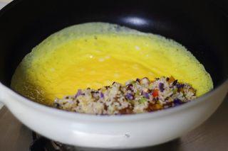 Omelette Fried Rice step 18: Place the fried rice on one side of the omelette.