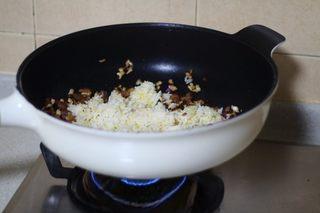 Omelette Fried Rice step 9: Add the cooked rice and break up any clumps while stir-frying.