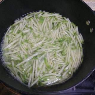 Korean Stone Pot Bibimbap step 2: Bring a pot of water to a boil. Blanch the zucchini until tender, then drain and