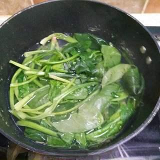 Korean Stone Pot Bibimbap step 3: Blanch the spinach until just cooked, then drain, cool slightly, and squeeze out