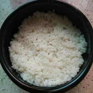 Korean Stone Pot Bibimbap step 5: Brush the inside of a stone bowl with sesame oil and spread an even layer of coo