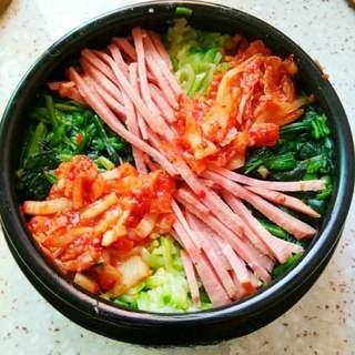 Korean Stone Pot Bibimbap step 6: Arrange the prepared vegetables, ham, and kimchi neatly over the rice.