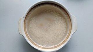 Century Egg and Pork Congee step 2: Rinse the rice thoroughly and add it to a pot with plenty of water. Bring to a b