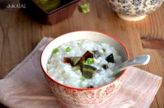 Century Egg and Pork Congee step 8: Garnish with chopped scallions and serve hot.
