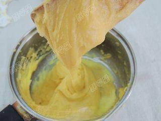 Classic Cream Puffs step 11: Continue adding egg until the dough becomes smooth, glossy, and slowly falls fro