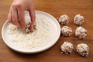 Steamed Glutinous Rice Meatballs step 4: Portion the meat mixture into 30 g balls. Roll each meatball in the soaked gluti