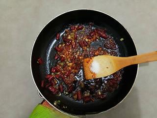 Spicy Garlic Shrimp with Doubanjiang step 8: Cook until the doubanjiang releases its red oil, then add a small pinch of sugar