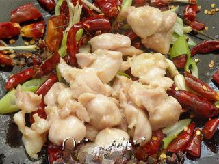 Sichuan Mala Chicken Recipe step 9: Return the fried chicken to the wok and toss to combine.