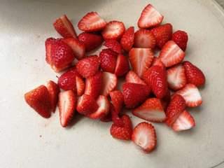 Strawberry Yogurt Mousse Cake step 12: Remove the stems and cut the strawberries into small pieces.