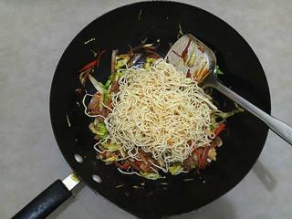 Stir-Fried Rice Noodles with Pork and Vegetables step 12: Add the steamed rice noodles to the wok.
