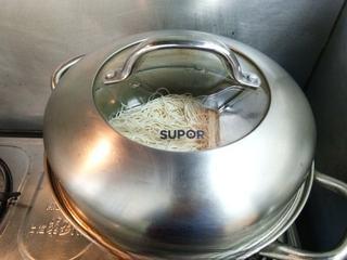 Stir-Fried Rice Noodles with Pork and Vegetables step 2: Place the noodles in a steamer basket and steam over boiling water for about 15 
