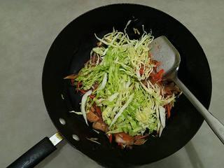 Stir-Fried Rice Noodles with Pork and Vegetables step 9: Add the cabbage and continue stir-frying until just tender.
