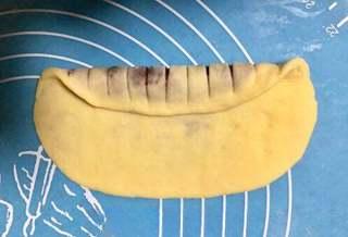 Milk Bread Caterpillar Rolls step 11: Roll the dough tightly from one end to the other.