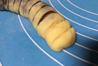 Milk Bread Caterpillar Rolls step 13: Use scissors to make two small cuts at one end to form antennae.