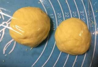 Milk Bread Caterpillar Rolls step 6: Punch down the dough, divide it into two equal portions, cover, and let rest for