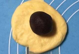 Milk Bread Caterpillar Rolls step 7: Roll each portion into a round sheet and place the red bean paste slightly off-c