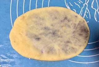 Milk Bread Caterpillar Rolls step 8: Wrap the filling completely and gently roll the dough into an oval shape.