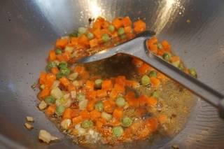 Stir-Fried Sweet Corn with Pine Nuts step 4: Heat oil in a wok over medium heat. Add the five-spice powder and scallions, the