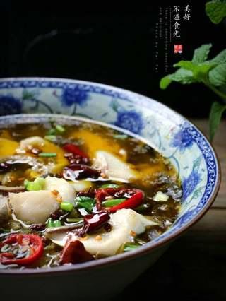 Sichuan Cod with Pickled Mustard Greens step 11: The pickled mustard greens provide a crisp, tangy contrast to the rich broth.