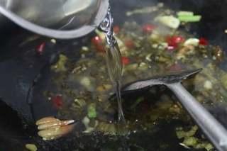 Sichuan Cod with Pickled Mustard Greens step 5: Pour in enough water to make a broth. Bring to a boil and simmer for about 5 min