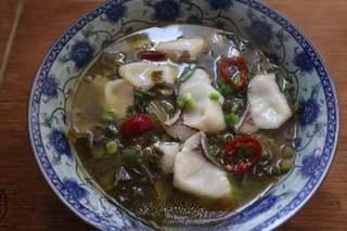 Sichuan Cod with Pickled Mustard Greens step 7: Cook over medium heat until the fish turns opaque and flakes easily. Gently stir