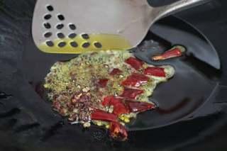 Sichuan Cod with Pickled Mustard Greens step 8: Heat the canola oil in a small pan. Add the dried chilies and Sichuan peppercorn