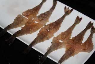 Crispy Breaded Prawns step 4: Slice open the underside of each shrimp and gently flatten it with the back of a