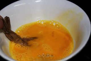 Crispy Breaded Prawns step 6: Dip each shrimp into beaten egg until fully coated.